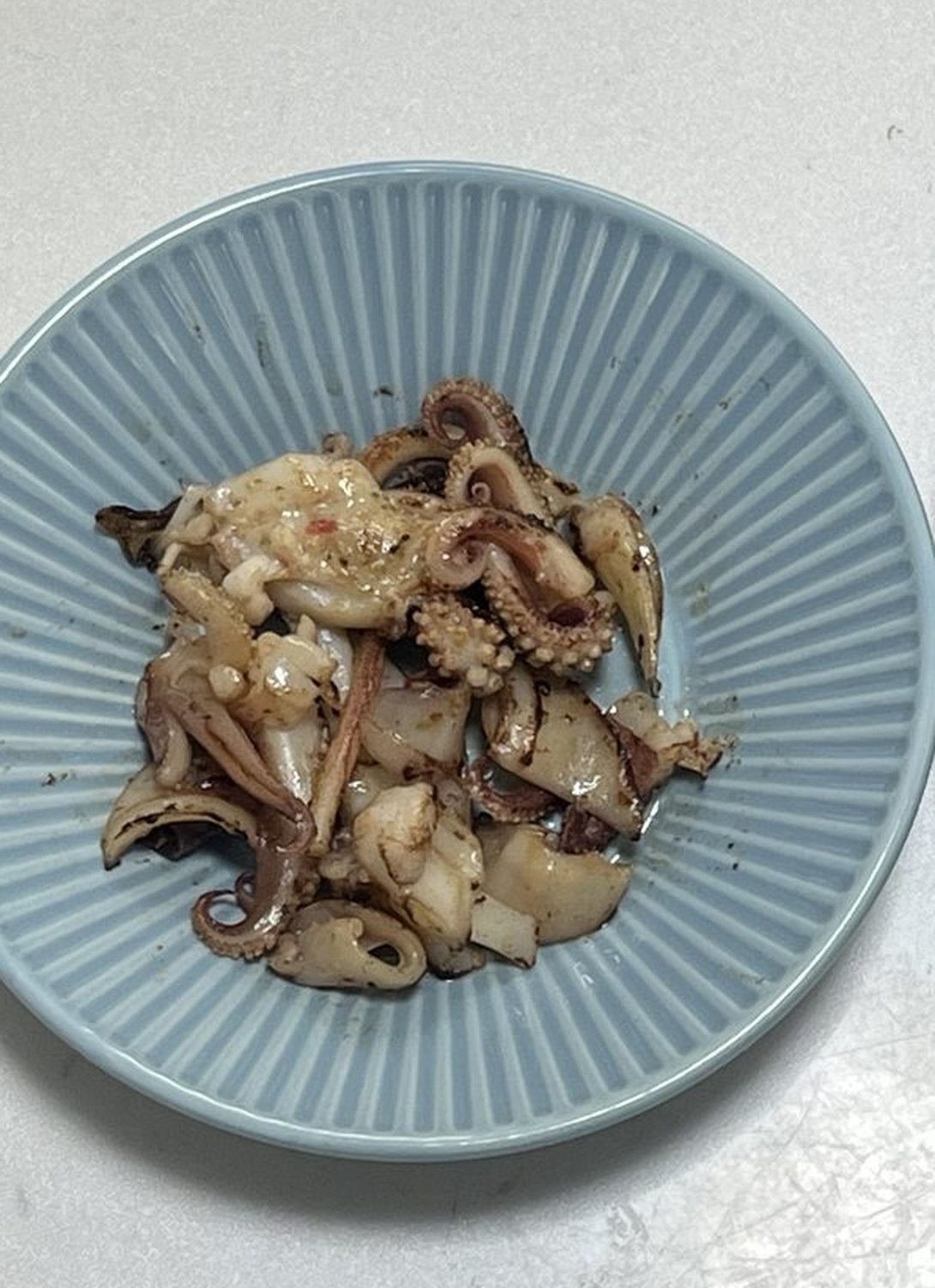 麺つゆの沖漬けにしたイカのゲソを焼いたもの
